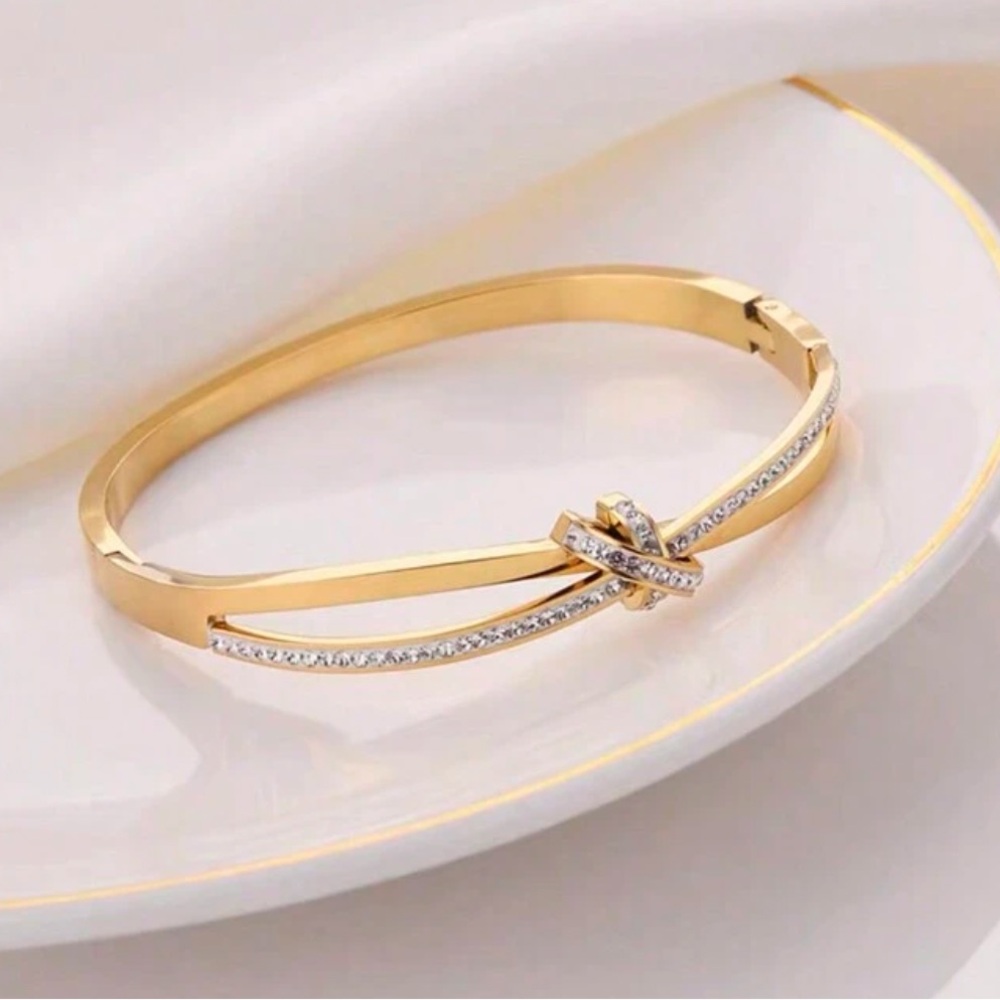 Gold plated stainless steel knot bangle bracelet